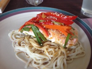 Asian salmon with carrots and peppers.